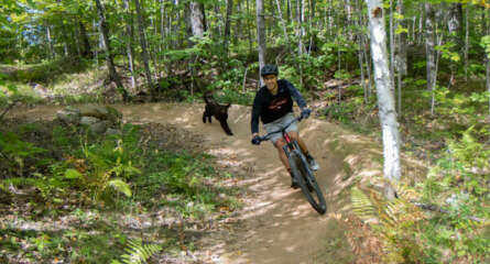 Musky Mountain biker with his dog